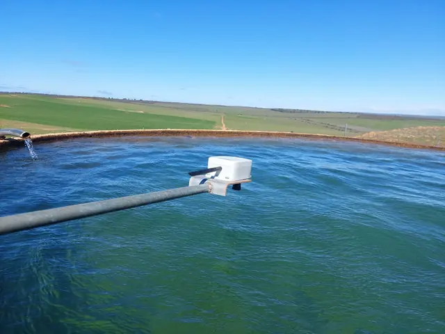 The Tank Level Sensor on a pipe reaching out over an open water tank, pointed down at the water
