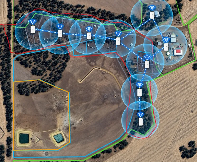 Satellite map of a property with overlapping blue coverage circles around a chain of outdoor access points
