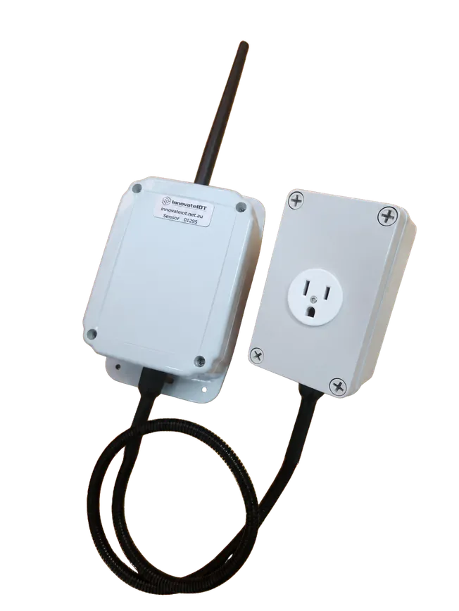 The power monitor communications unit with antenna wired to a grey outlet box
