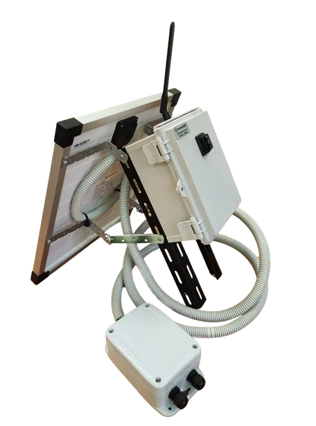 The DC solar pump controller: enclosure with antenna beside a small solar panel