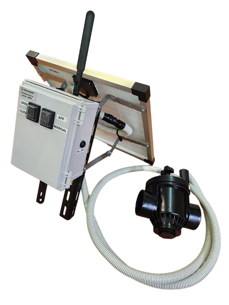 The valve controller: enclosure with antenna, a small solar panel, and a solenoid valve on a hose