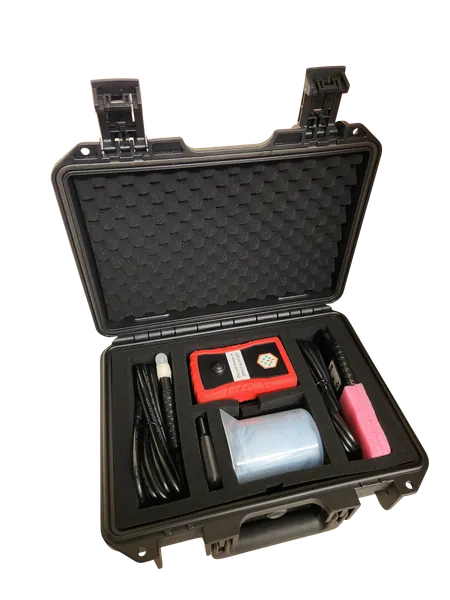 The hard case open with the soil analyzer unit, probes, beaker, and charging cable in foam