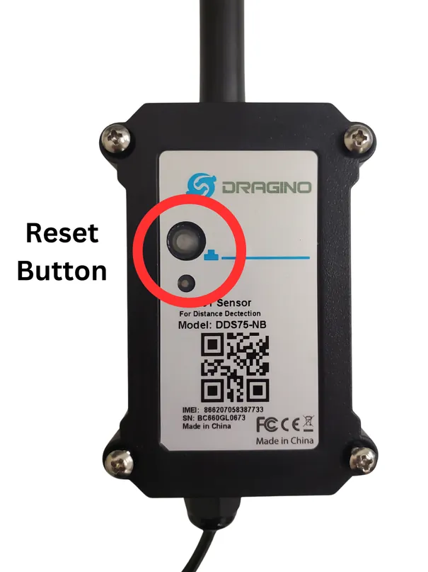 Inside the sensor cover with the reset button circled on the black box