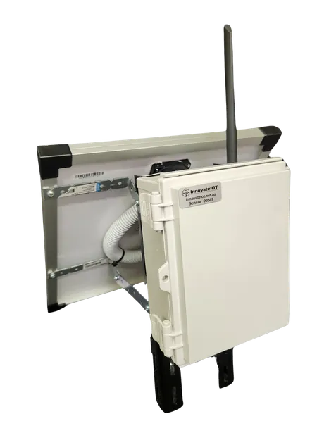 A white enclosure on a post with a small solar panel on top