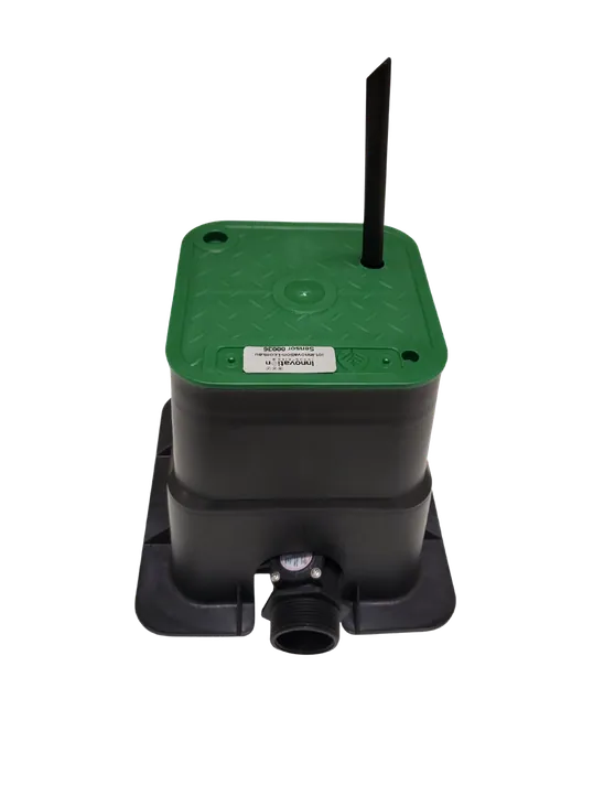 The communications box inside a green-lidded irrigation valve box