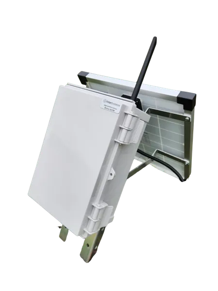 The white power and communications enclosure with the solar panel hinged on top