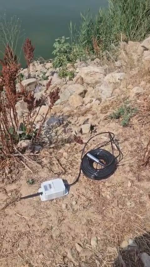 A 165 ft dam level sensor for an evaporative sewer pond in Eden, Utah